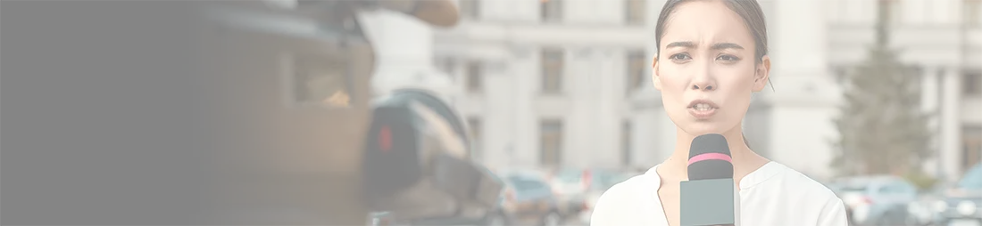header image of reporter in front of government office
